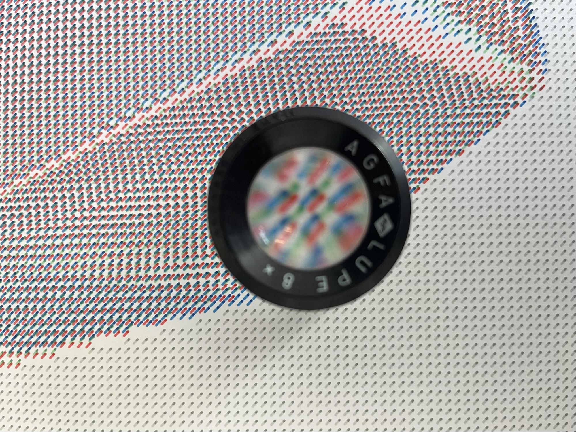 Detail of a Casey Reas SIMULACRUM drawing, as seen through a magnifier, 2025 (Photo by Zsofi Valyi-Nagy)